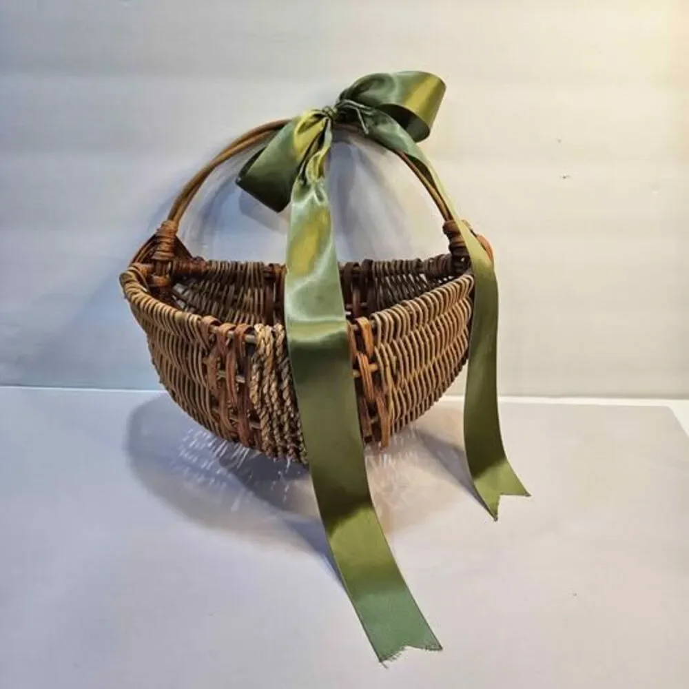 Wicker Basket with Green Ribbon, Broken Handle. Flat side. Wall decor